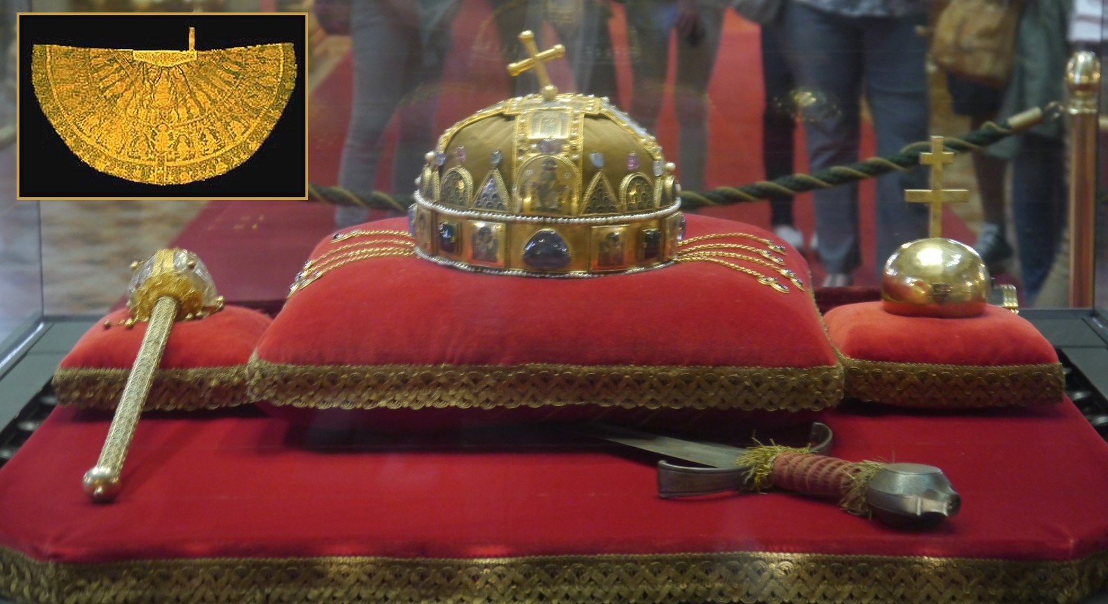 The coronation regalia together: the Holy Crown, the sceptre, the orb and the sword, and the coronation mantle